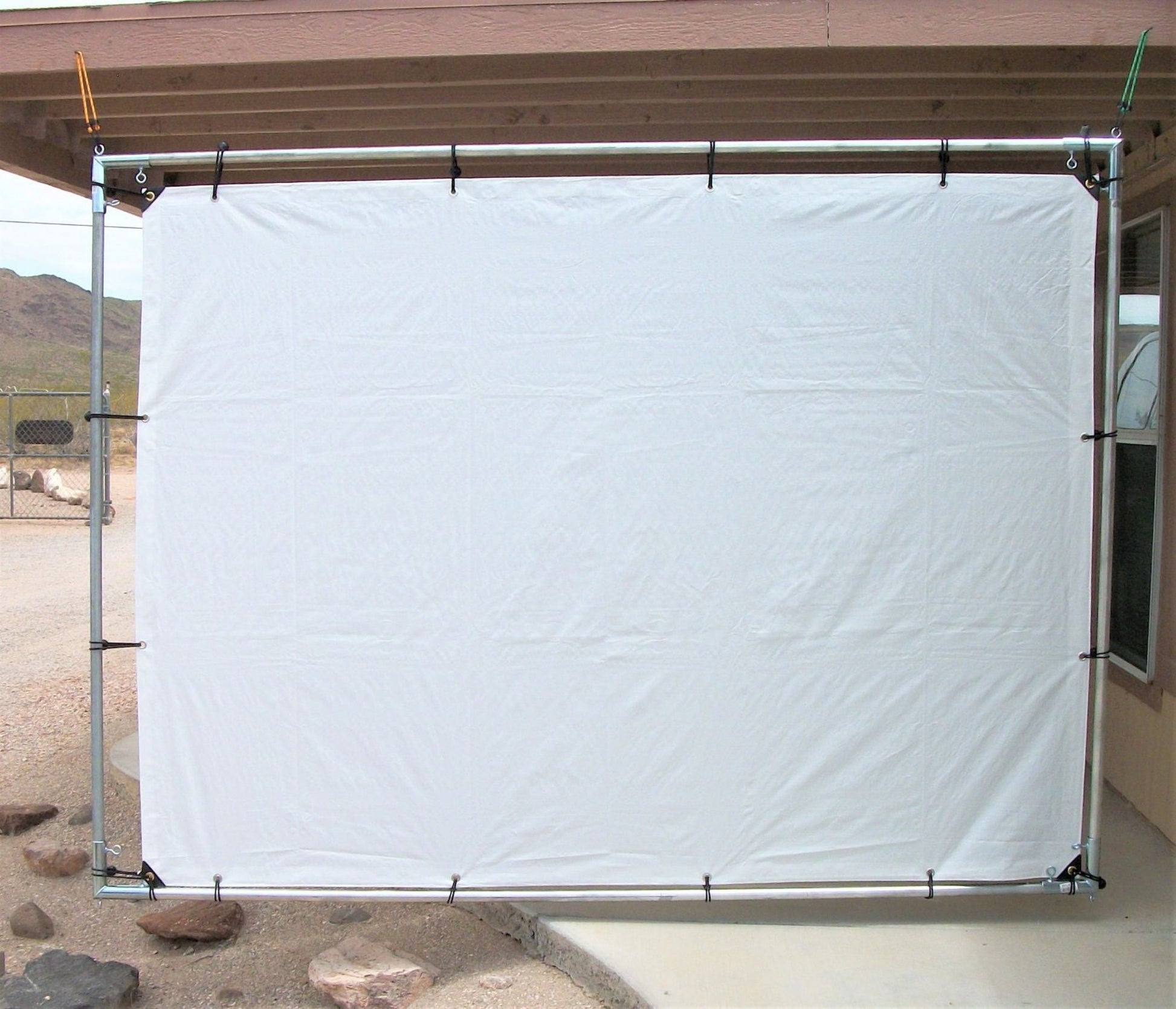 Outdoor hanging projection movie screen kit with white tarp and galvanized steel frame fittings 