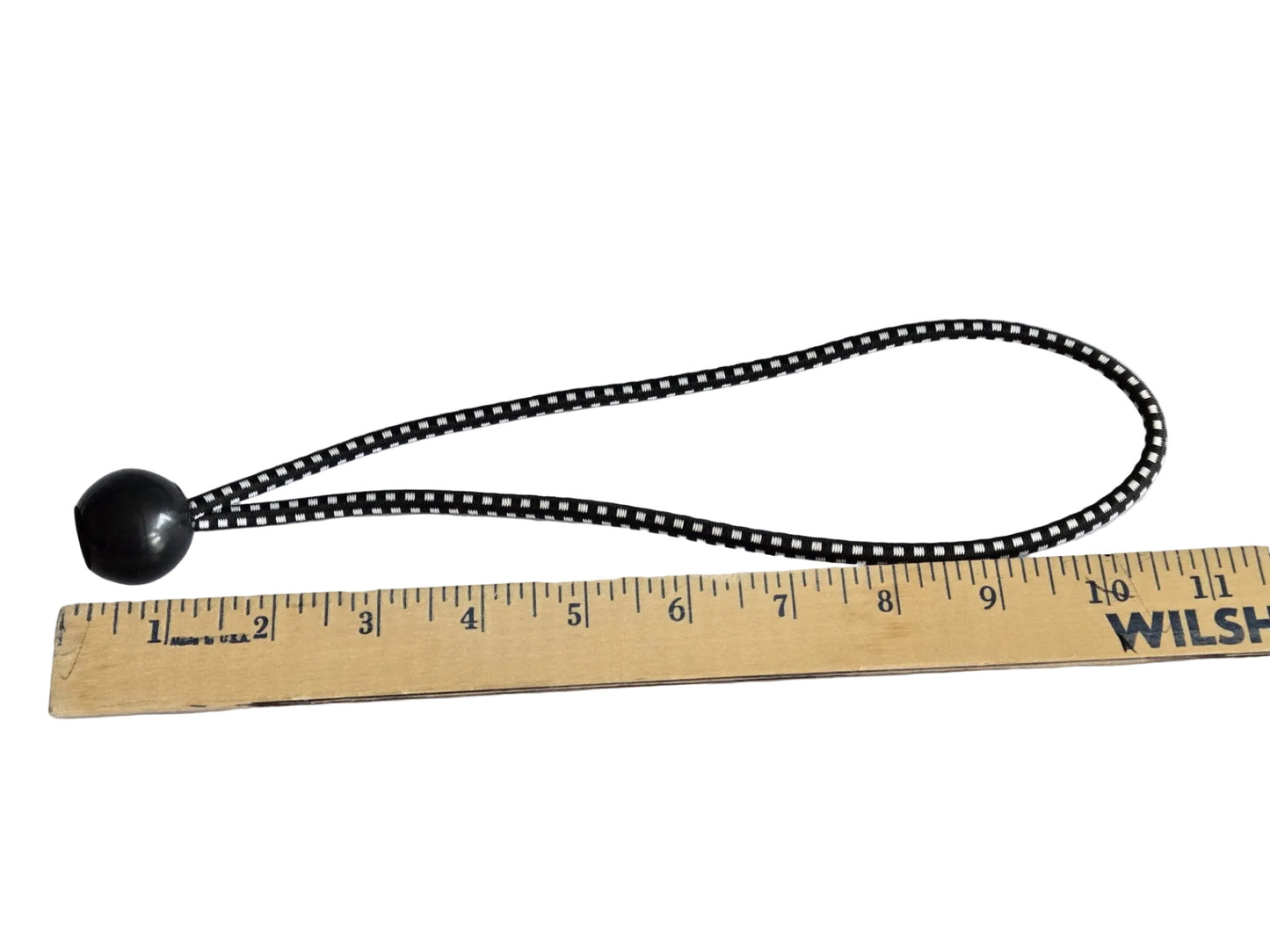 11 inch ball bungee measured against a wooden ruler.