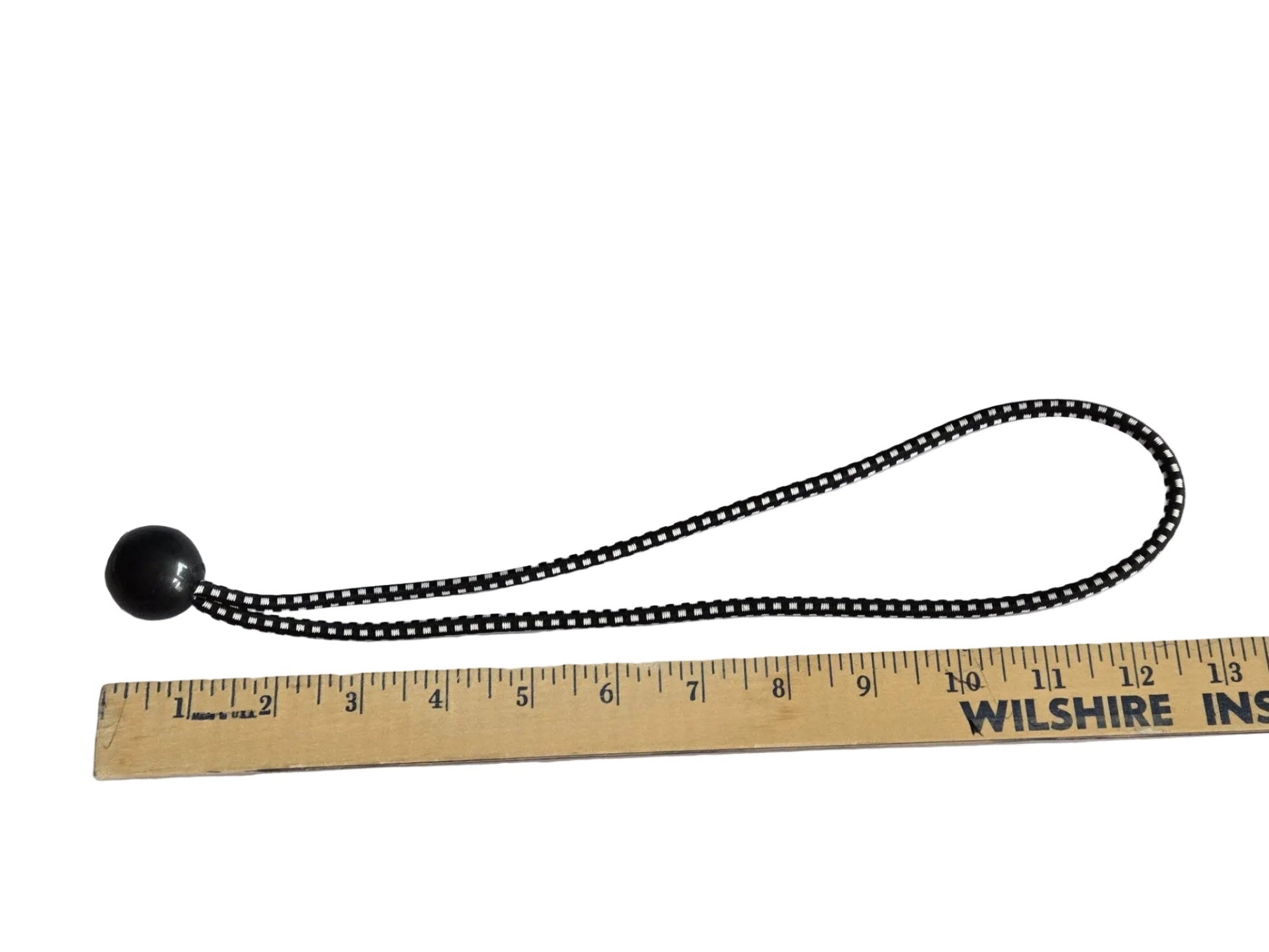 13 inch ball bungee measured against a wooden ruler.