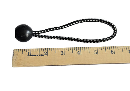 6 inch ball bungee measured against a wooden ruler.